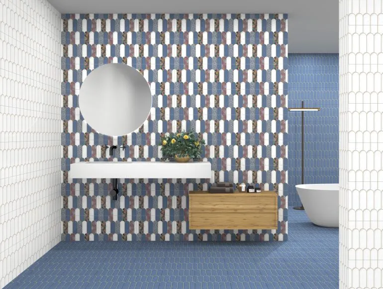 Blue bathroom design showcasing popsicle floral tiles, sink and bathtub